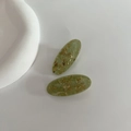 Pair of oval light green resin hair clips with natural wood fiber and vintage forest style - Green