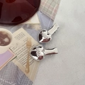 Y2K style silver heart-shaped hair clips with miu relief on red tray and plaid cloth - Letter Heart Style (miu) / Silver