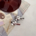 Detail of silver bear hair clips on vintage background with bow and heart accents - 3D Cartoon Bear Style / Silver