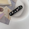 Fermaglio Y2K nero con motivo a stella bianca e strass multicolore in finitura variante - Nero