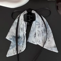 Detail of white fabric bow hair clip with black ink painting print and flowing ribbons - Ribbon Shape Claw Clip / Blue