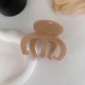 Detail showing 'FRANCE handmade' engraving on a translucent tortoiseshell hair claw clip - Milk Coffee