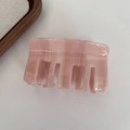 Macro detail of jelly aurora acetic acid hair claw clip in pastel lotus pink marble pattern - Lotus root pink