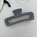 Minimalist deep grey rectangular hollow hair claw clip with a glossy resin finish - Gray