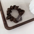 Detail of dark brown satin scrunchie with a heart-shaped Lucky engraved gold buckle - Coffee - Heart