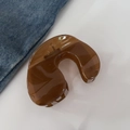 Elegant amber translucent hair claw clip in a smooth U-shaped minimalist design - Tea Jelly Color