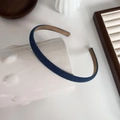 Close-up of blue denim headband texture with non-slip lining on a white bottle - Slim Dark Blue