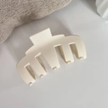 Detail view of cream matte hair claw clip with strong spring and rounded teeth for thick hair - Off-white