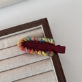 Rainbow woven yarn hair clip with burgundy base and handmade crochet texture - Red