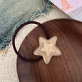 Brown elastic hair tie with a double-layered jelly star ornament on a wooden tray - Star Shape (Champagne Hair Tie) / Champagne Hair Tie