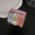 Set aus gewellten elastischen Haarbändern in bunten Farben in einem transparenten Glas - Wellen-Stil / Macaron Serie