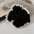 French vintage black velvet scrunchie with lace trim on grey knit background - Black