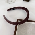 Close-up of brown velvet headband with handmade label and silver charm detail - Coffee Purple