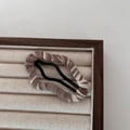 Brown and white wool-wrapped cloud-shaped snap hair clip on elegant wooden display stand - Brown