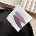Close-up of two oval candy-colored hair clips in purple and marbled finish - Purple
