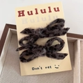 Detail of plush leopard print bow hair clips with gold threads on display card - Gray Leopard Side Clip