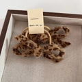 Leopard print bow hair scrunchies with gold trim on a wooden tray for women - Light Leopard Scrunchie
