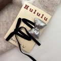 Detail of black velvet and silver leather bow hair clips on a display card for styling - Silver Bow BB Clip