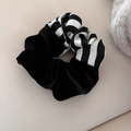 Detailed close-up of velvet and striped satin patchwork oversized hair scrunchie - Black Stripe