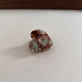Detailed view of handmade acetate heart hair claw with marble texture and gold lettering - 7# Light Green Coffee
