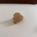 Detail of amber heart-shaped acetate hair clip with golden France Handmade engraving - Milk Coffee