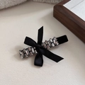 Detailed view of luxury black ribbon hair clip with sparkling crystals and bow accent - Double Row Trapezoid Rhinestone Bowknot Style