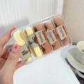 Elastic hair ties in beige and orange with bear tags, organized in a four-grid clear box - Beige and Milk Coffee
