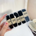 Detail of high-elasticity black hair ties neatly organized in a transparent 5-slot storage box - 4# Black