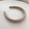 Detail view of wide sponge headband in light beige fabric with anti-slip black lining - Beige