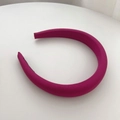 Detail of rose red padded fabric headband showing smooth texture on white background - Rose Red