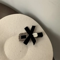 Macro shot of retro black velvet hair clip with rhinestone buckle and metal tag - Square Rhinestone Bow Duckbill Clip / Black