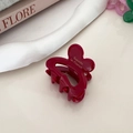 Close-up of a burgundy rabbit claw clip with gold Barrette La France text and spring detail - Red