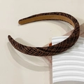 Detailed view of the dark brown tweed texture and non-slip suede lining of this vintage headband - Brown