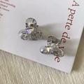 Détail de mini pinces à cheveux en forme de nœud avec strass cœur et ressort doré - Gris fumé