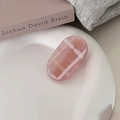 Detailed close-up of pink geometric checkered oval hair clip on a white ceramic tray - Oval Pink White Plaid Style (6#)