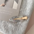 Detailed macro shot of a gold-plated seamless hair clip with mosaic pearlescent inlay - Light Gray