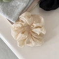 Detailed view of cream ruffled mesh hair tie with lightweight organza silk texture - Large / Beige