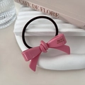 Close-up of pink acetate bow hair tie featuring a golden Barrette La France inscription - Pink