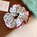 Detail of floral scrunchie with red contrast edging and vintage flower pattern fabric - Floral Style