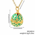 Vintage green enamel egg necklace with gold cross pattern and dimensions display - Green