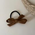 Elegant brown wool bow hair scrunchie with high elasticity rubber band on neutral background - Coffee