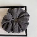 Detailed close-up of dark grey knitted hair scrunchie showing fine fabric texture - Dark Gray