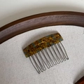 Close-up of handmade tortoiseshell acetate hair comb with ten durable metal teeth - Tortoise Blue
