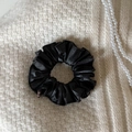 Close-up of black PU leather scrunchie on beige knit fabric with pearl necklace detail - Black (3# Black PU Scrunchie)