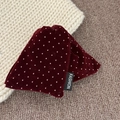 Detail shot of vintage burgundy velvet hair claw clip with pink polka dots and fashion label - Triangle / Burgundy Polka Dot