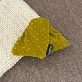 Detail showing mustard green velvet polka dot hair clip with a fashion woven label - Triangle / Ginger Yellow Polka Dot