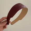 Detail of burgundy leather headband with yellow contrast stitching and soft lining - Burgundy