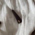 Detail view of a vintage coffee brown felt hair clip with a gold 'Hand Made' metal plaque - Brown Long Triangle Style (1#)