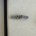 Dark grey plush hair clip with a luxury rhinestone bow design on a textured board - Light Gray Oval Bow Style