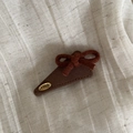 Macro shot of brown felt bow hair clip with vintage golden tag on linen background - Triangle / Solid Coffee Triangle Bow Clip